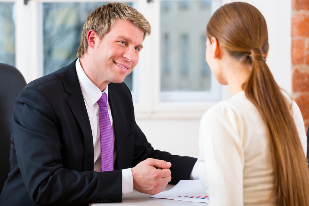 Young lawyer, insurance agent or attorney working in his office