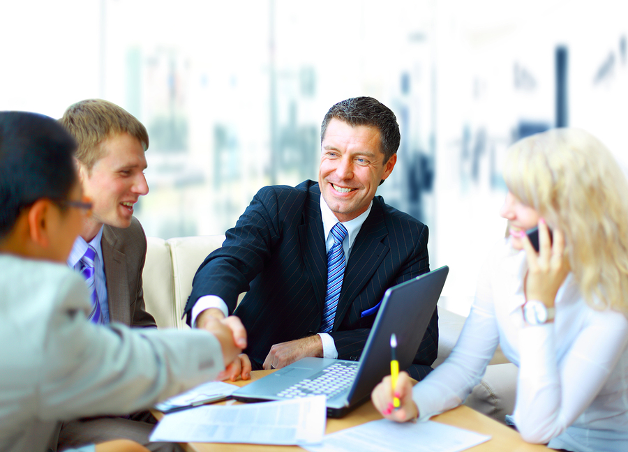 Business people shaking hands, finishing up a meeting